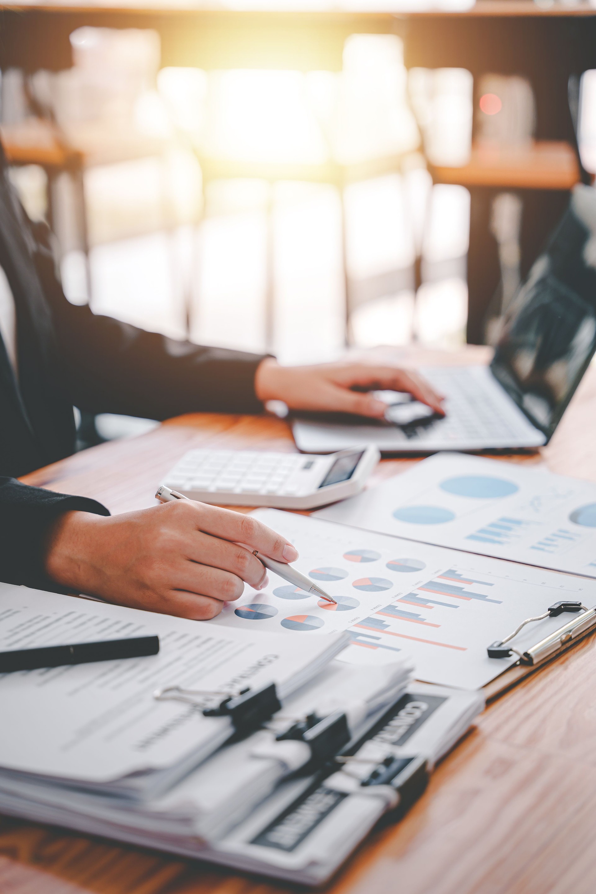 Portrait of a woman working on a tablet computer in a modern office. Make an account analysis report. real estate investment information financial and tax system concepts