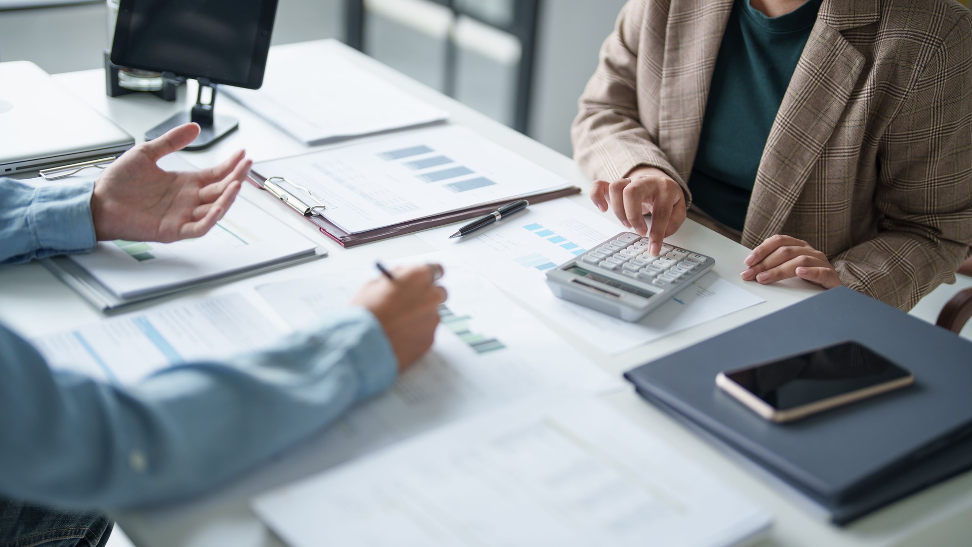 business man Auditor or internal revenue service staff checking annual financial statements company Audit Â Accounting tax.